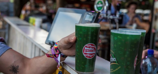 Drinks being served at an event with a card terminal